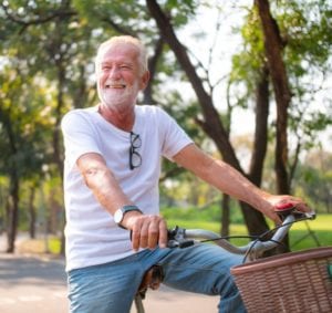 older man on bike | Mohs Surgery