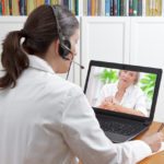 Doctor during an onlinecall with a female patient showing a large mole