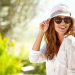 Smiling summer woman with hat and sunglasses